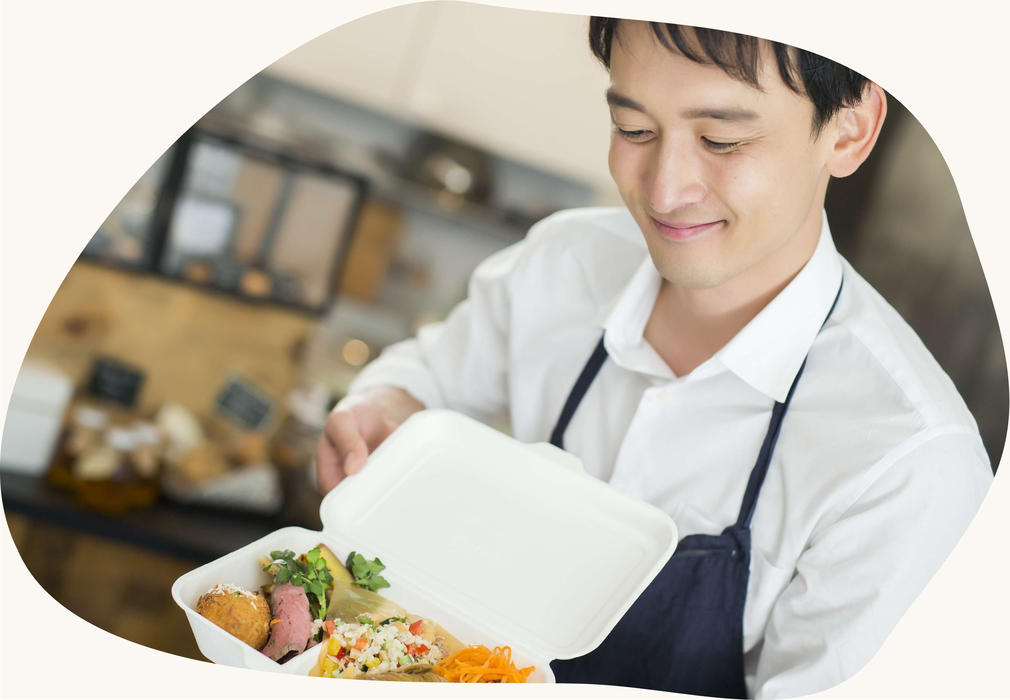 メインビジュアル(お弁当を持つ男性)